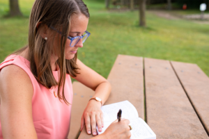 Woman journaling at a park